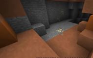 Gold ore generated on the surface of a mesa biome in Minecraft (Image via iDeactivateMC/YouTube)